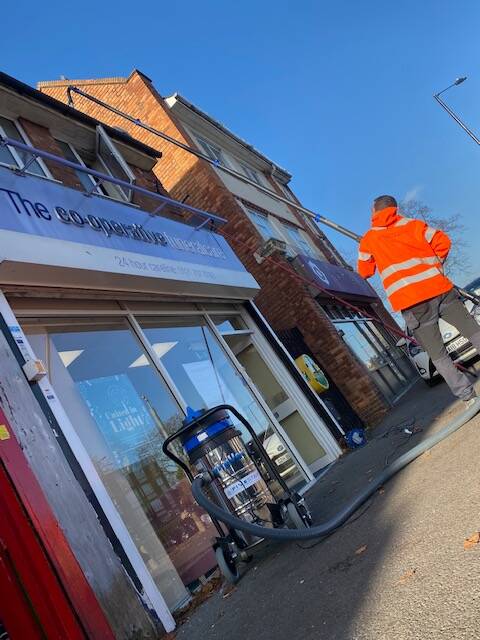 a gutter being cleaned with our gutter cleaning equipment