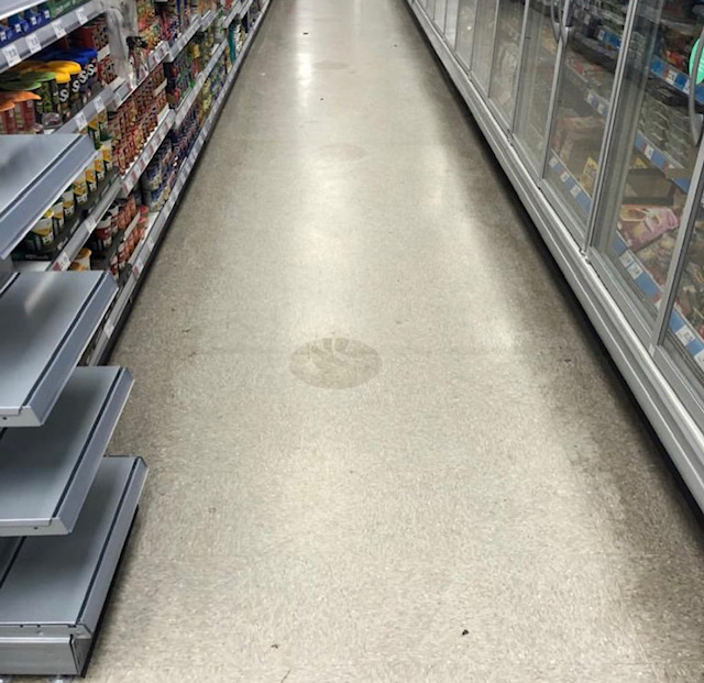 a long strip of floor, stripped and ready to begin floor polishing